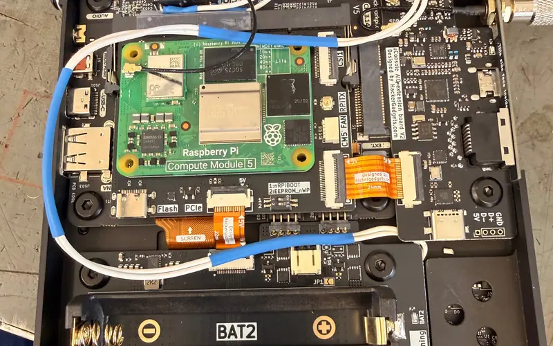 Preview image from ClockworkPi forum for “Reset microswitch through the antenna hole (HG board)”